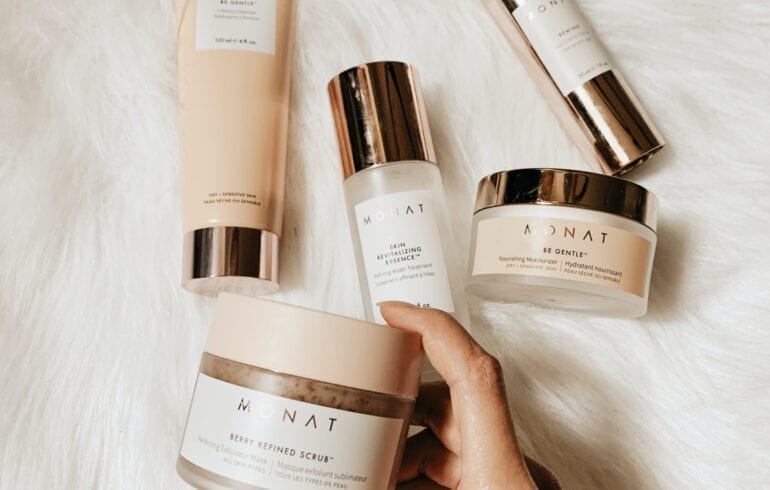 Woman showcasing a high-quality moisturizer for hydration and nourishment
