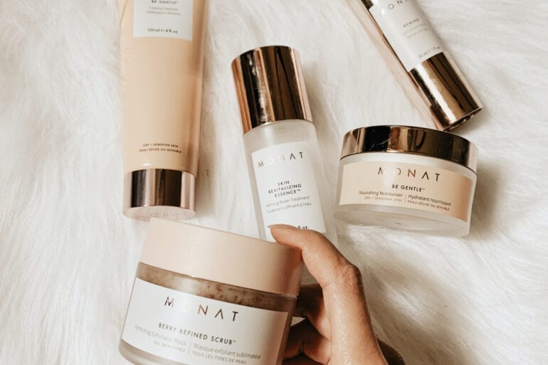 Woman showcasing a high-quality moisturizer for hydration and nourishment